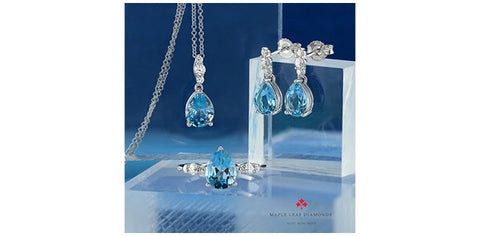 Maple Leaf Canadian diamond pendant with a blue topaz